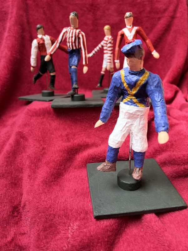 Models of footballers wearing historic Doncaster Rovers kits to illustrate periods of the club's history.