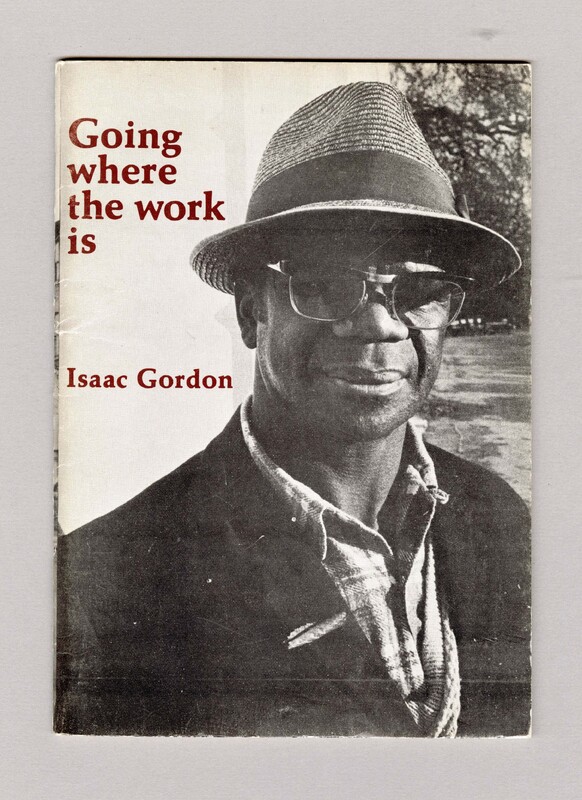 The cover features a photograph portrait of Issac Gorden, wearing a straw hat, glasses, checkered shirt and dark coloured jacket.
