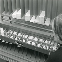 Student operating an IBM card sorting machine, 1967.