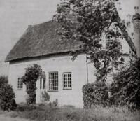 Photograph of the exterior of E.M. Barraud's cottage in Cambridgeshire. 