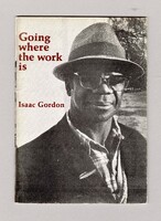 The cover features a photograph portrait of Issac Gorden, wearing a straw hat, glasses, checkered shirt and dark coloured jacket.