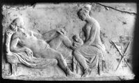 Stone carving of two women bathing.