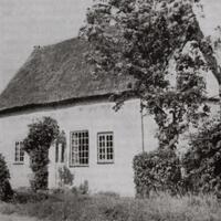 Photograph of the exterior of E.M. Barraud's cottage in Cambridgeshire. 