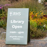 A sign directing garden visitors to an RHS library